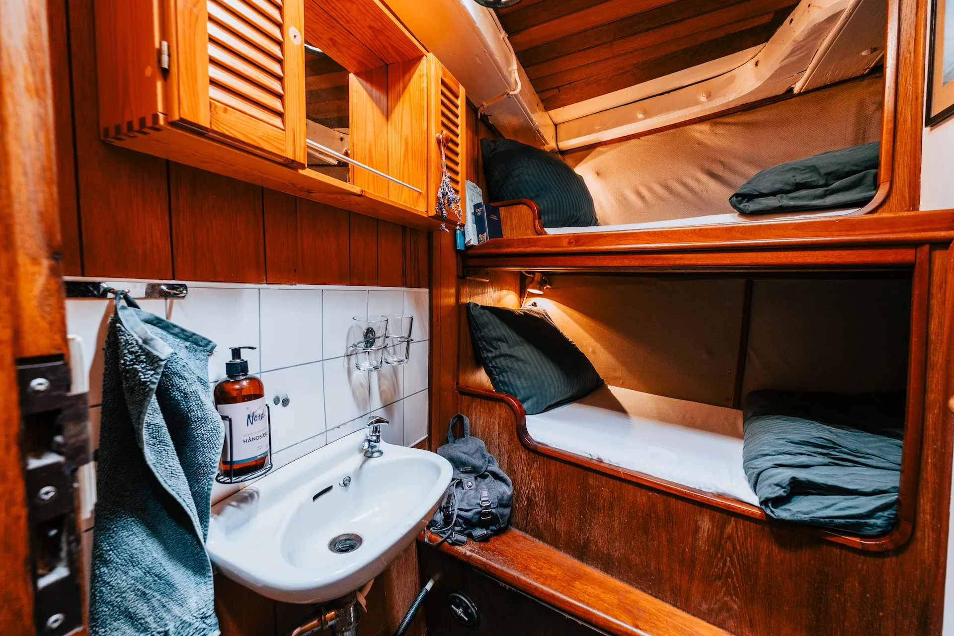 A double cabin aboard Aron with a washbasin