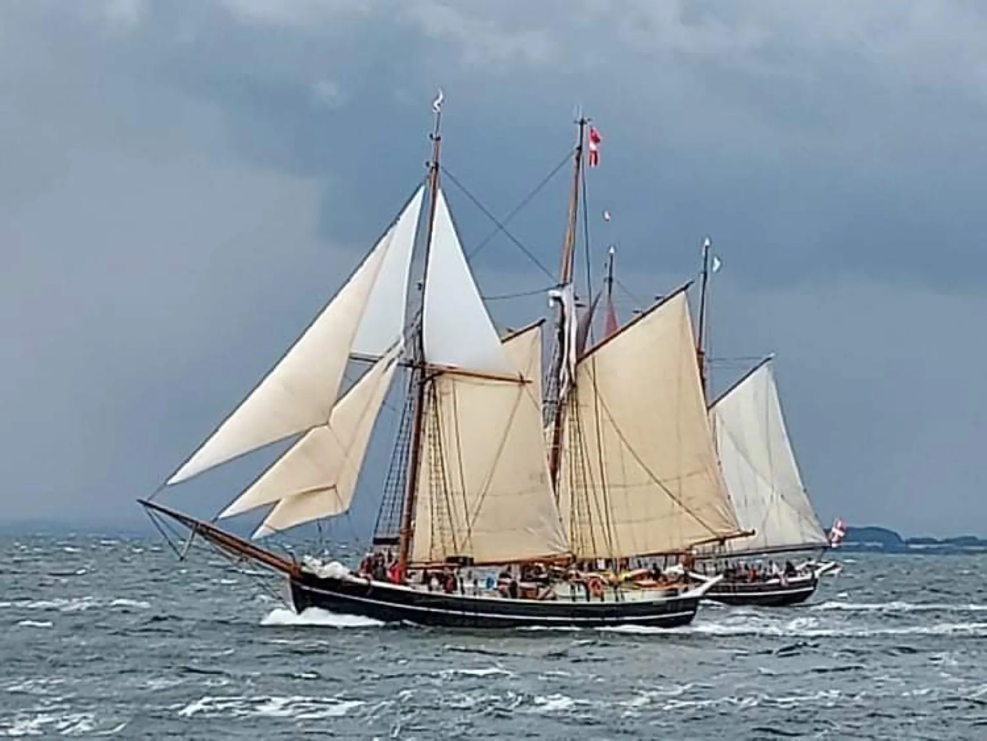 Aron heeling in fresh winds with another schooner astern